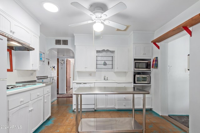 kitchen with white cabinetry, sink, ceiling fan, crown molding, and white appliances