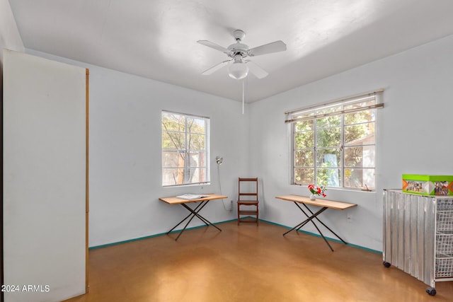 miscellaneous room featuring radiator heating unit and ceiling fan