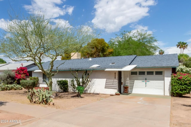 single story home featuring a garage