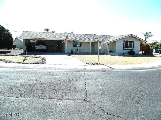 view of front facade with a carport