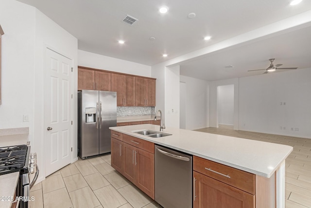10502 W Bronco Trl, Peoria, AZ 85383 - kitchen featuring appliances with stainless steel finishes, a sink, a ceiling fan, recessed lighting, and backsplash