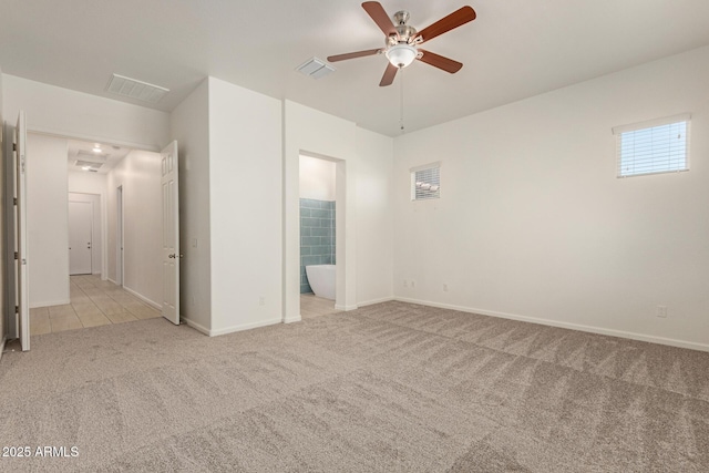 10502 W Bronco Trl, Peoria, AZ 85383 - unfurnished bedroom featuring carpet flooring, baseboards, and connected bathroom