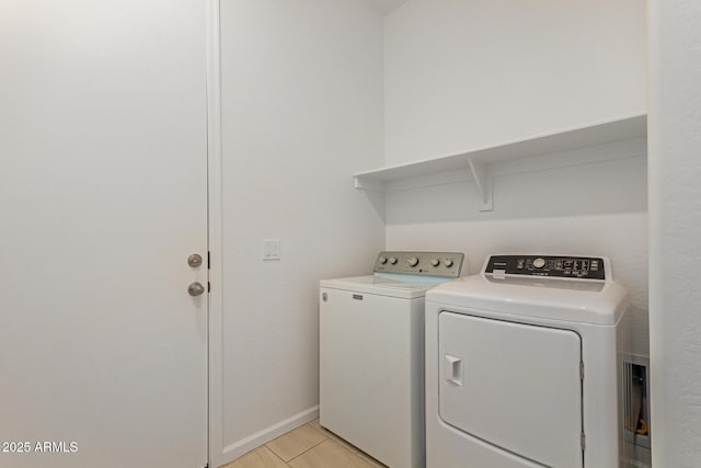 10502 W Bronco Trl, Peoria, AZ 85383 - washroom with washer and clothes dryer, baseboards, and light wood-type flooring