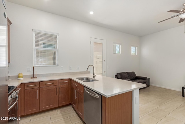 10502 W Bronco Trl, Peoria, AZ 85383 - kitchen featuring appliances with stainless steel finishes, a sink, a ceiling fan, light countertops, and light tile patterned floors