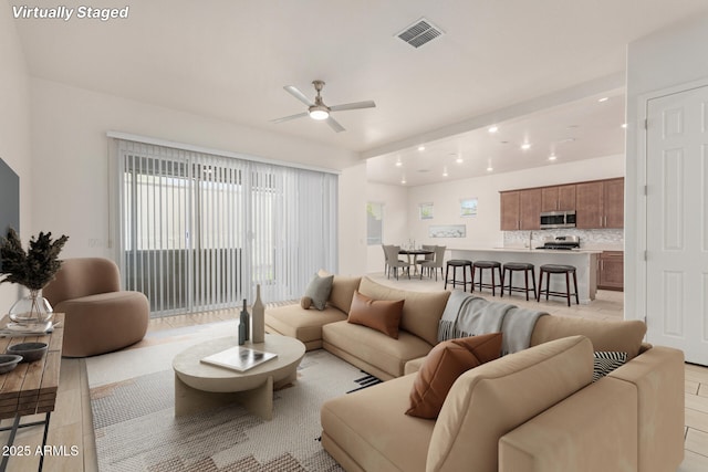 10502 W Bronco Trl, Peoria, AZ 85383 - living room featuring ceiling fan, recessed lighting, and light tile patterned flooring
