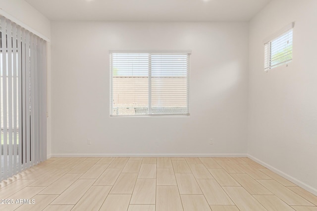 10502 W Bronco Trl, Peoria, AZ 85383 - unfurnished room with baseboards and light wood-style floors