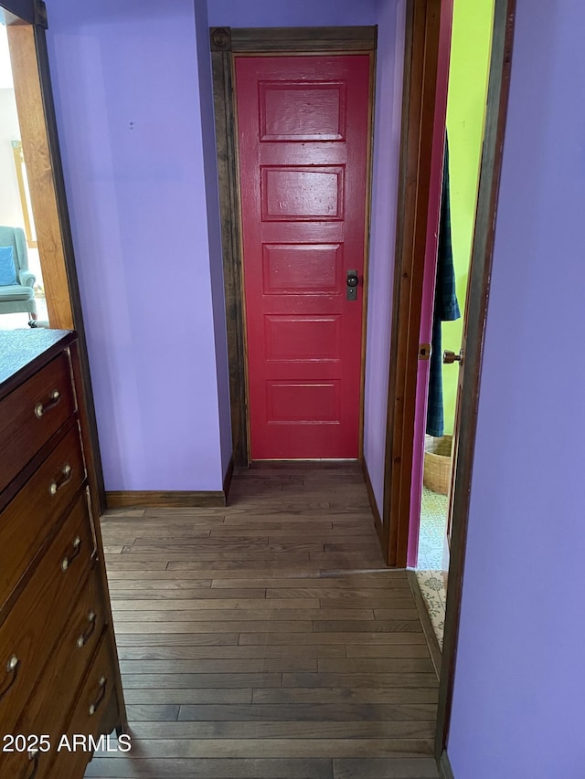 corridor featuring dark wood-type flooring