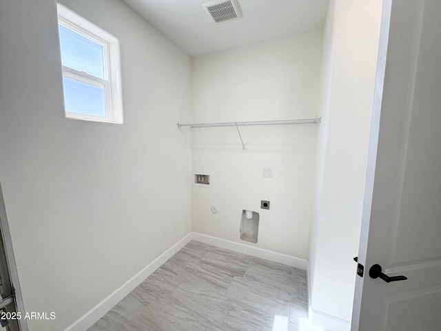 laundry area featuring laundry area, baseboards, visible vents, washer hookup, and electric dryer hookup