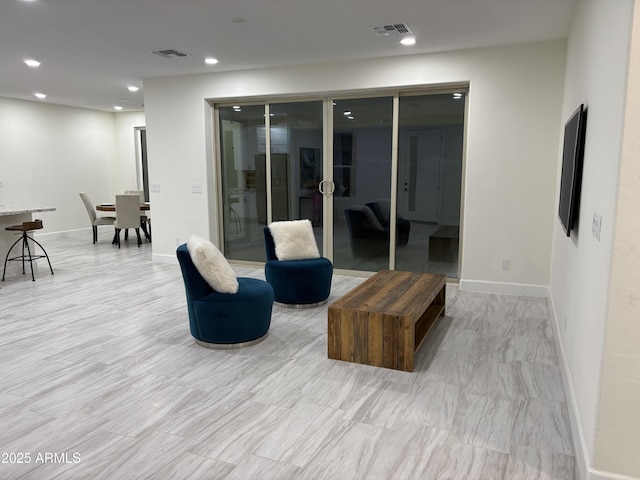 interior space with baseboards, visible vents, and recessed lighting