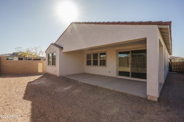 rear view of house featuring a patio