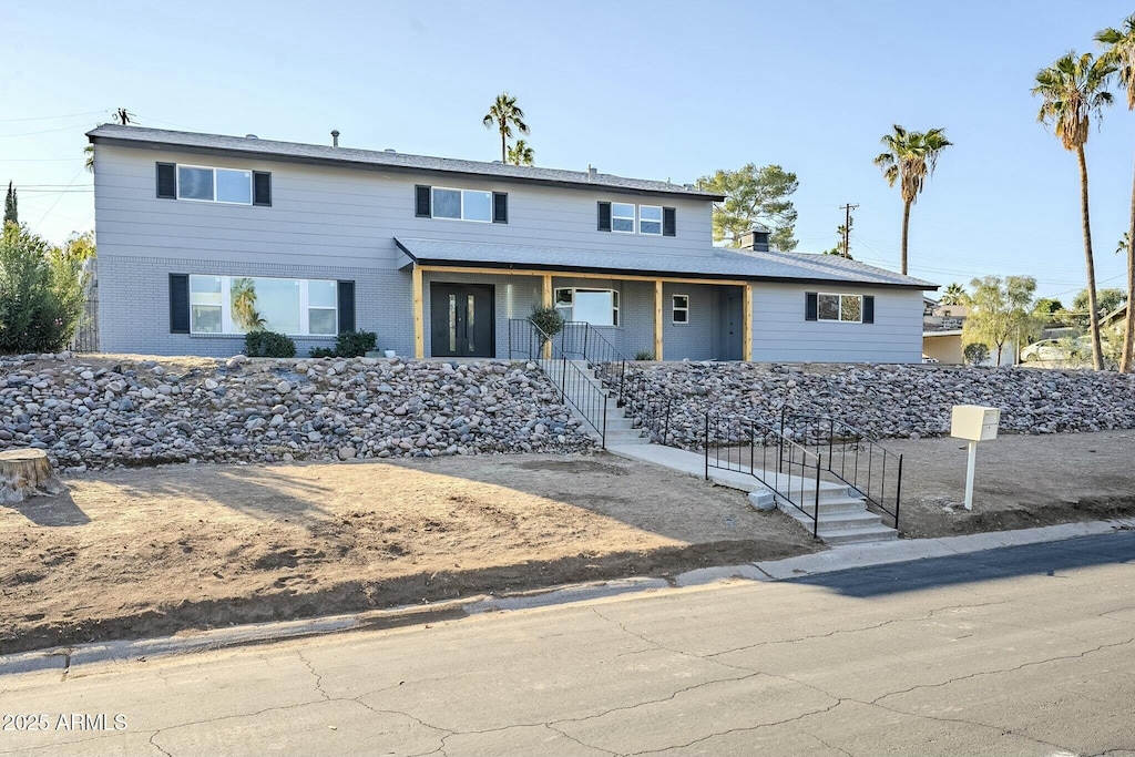 925 W Fairway Dr, Mesa, AZ 85201 - view of front of home with covered porch, brick siding, and stairs