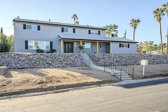925 W Fairway Dr, Mesa, AZ 85201 - view of front of home with covered porch, brick siding, and stairs