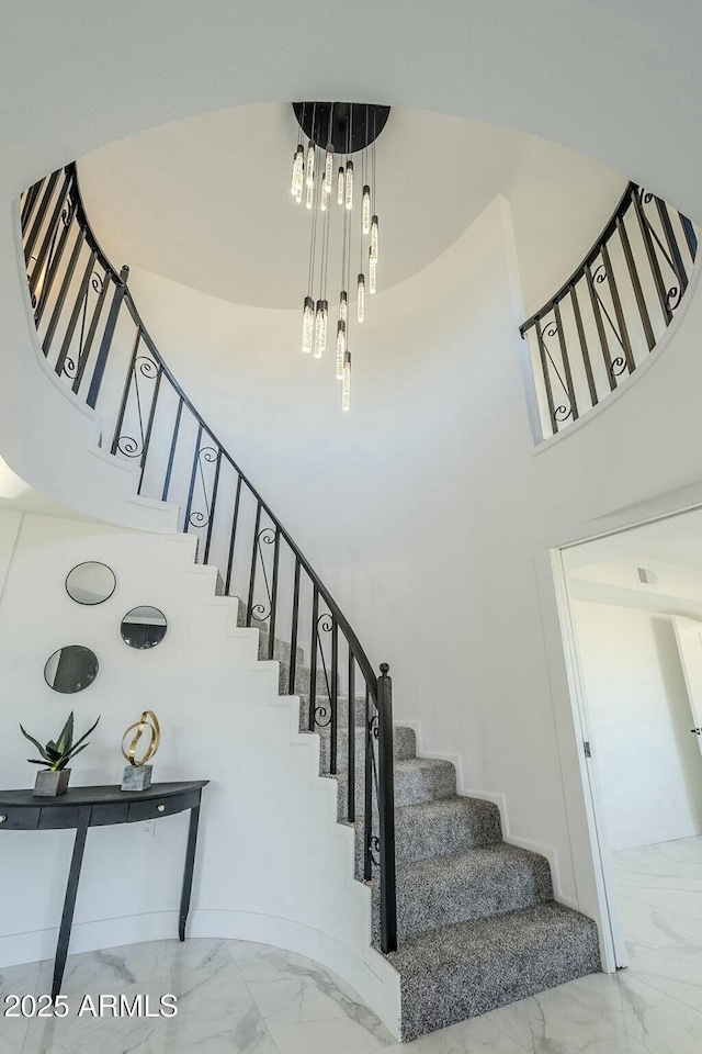 stairway with a towering ceiling