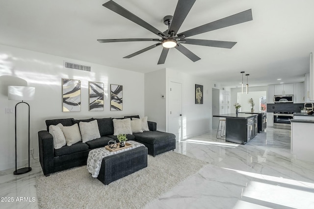 living room featuring ceiling fan