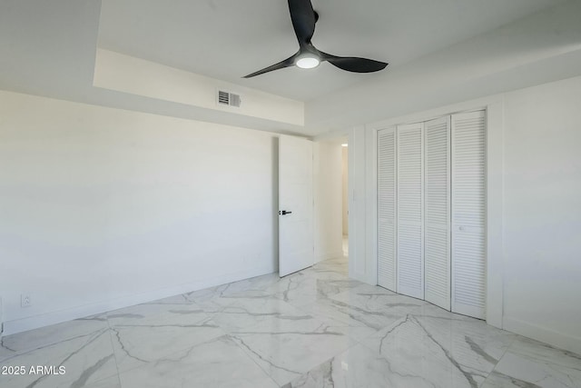 unfurnished bedroom featuring a closet and ceiling fan