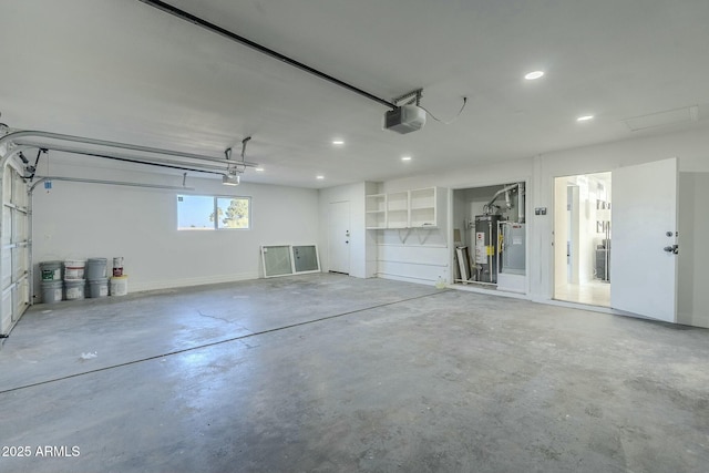 garage with a garage door opener and gas water heater