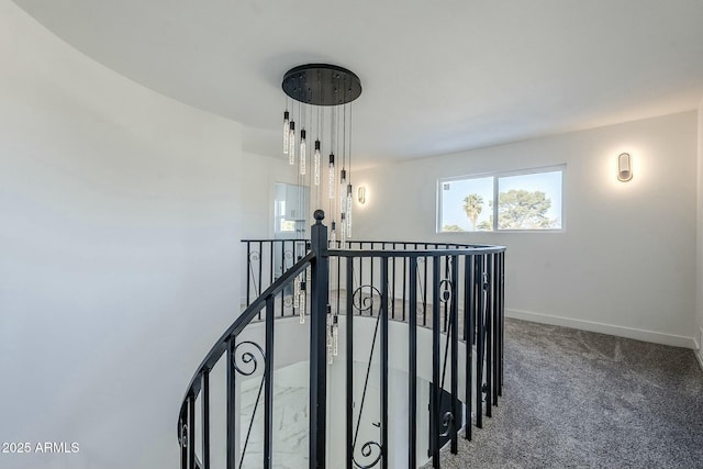 hallway with carpet floors