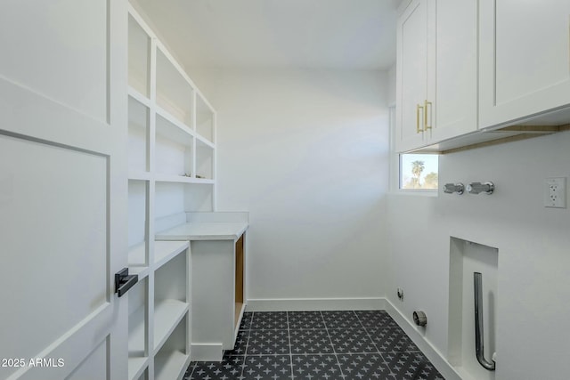 laundry area featuring cabinets, hookup for an electric dryer, and washer hookup