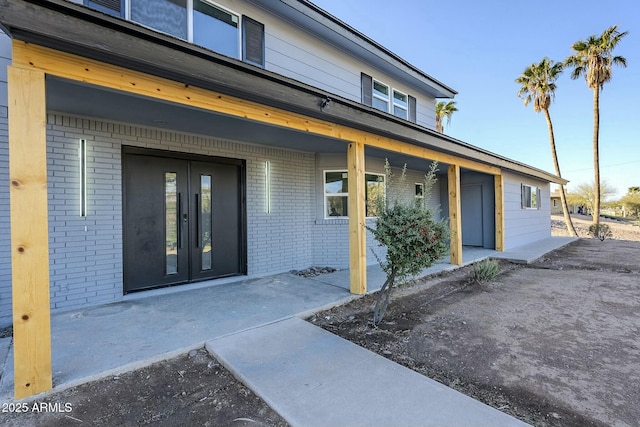 entrance to property featuring french doors