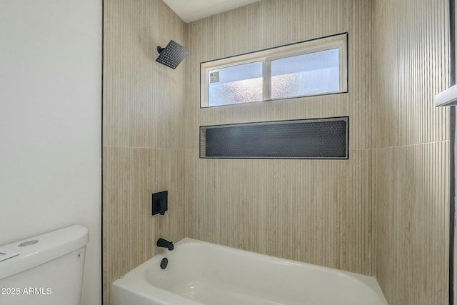 bathroom with toilet and shower / bathing tub combination