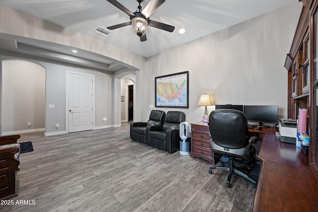1319 N Chatsworth St, Mesa, AZ 85207 - office featuring arched walkways, visible vents, a ceiling fan, wood finished floors, and baseboards