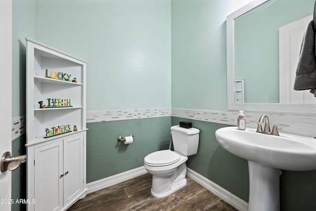 1319 N Chatsworth St, Mesa, AZ 85207 - bathroom with baseboards, a sink, toilet, and wood finished floors