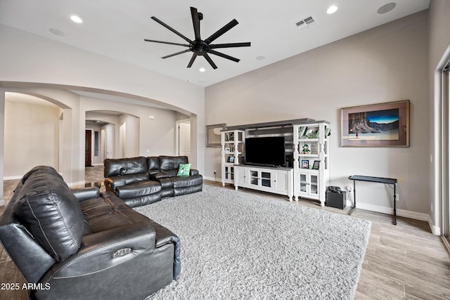 1319 N Chatsworth St, Mesa, AZ 85207 - living area with visible vents, arched walkways, baseboards, light wood-type flooring, and recessed lighting
