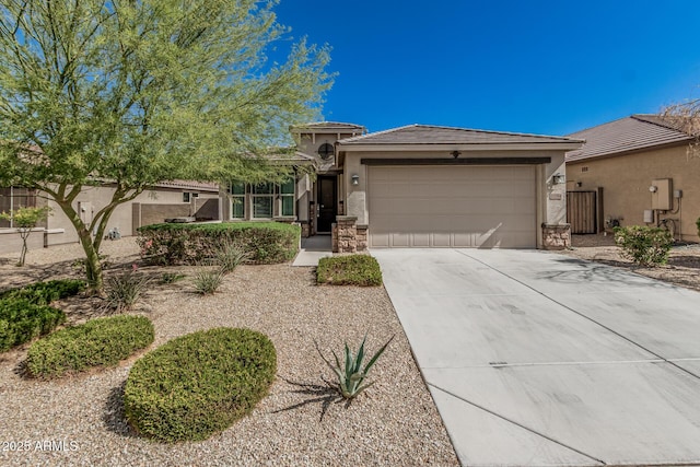 view of front facade with stucco siding, driveway, fence, an attached garage, and a tiled roof