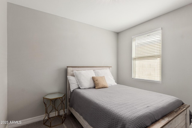 bedroom with carpet and baseboards