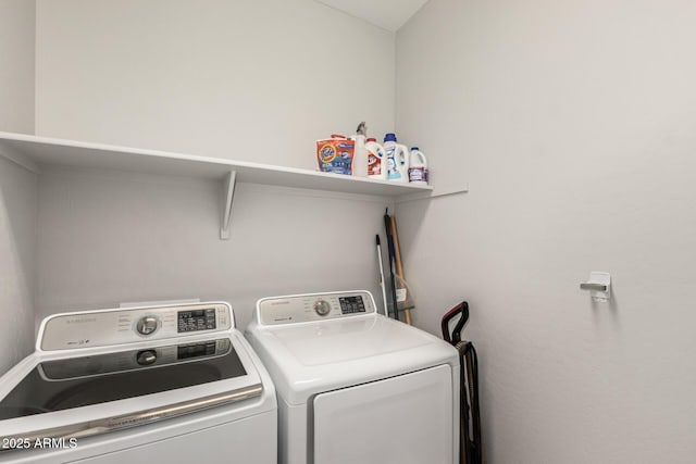 washroom with separate washer and dryer and laundry area