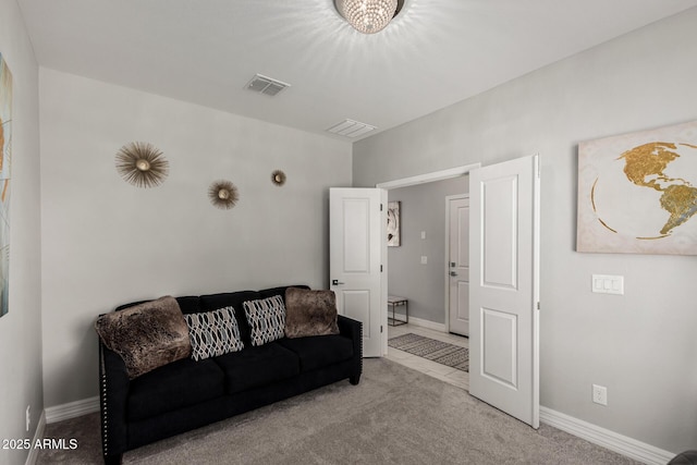 living area featuring visible vents, carpet floors, and baseboards