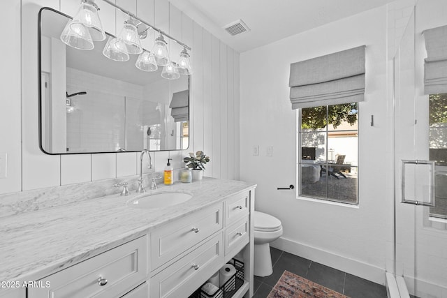 bathroom featuring tile patterned floors, toilet, an enclosed shower, and vanity