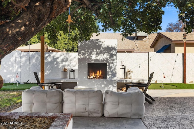 view of patio featuring exterior fireplace