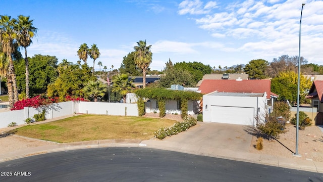 view of front of house with a garage and a front lawn