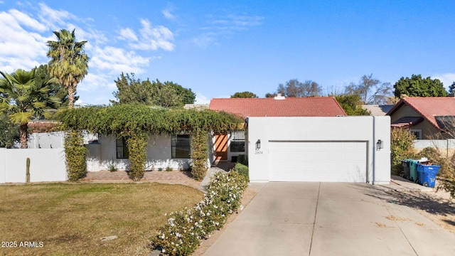 view of front of house featuring a front yard and a garage