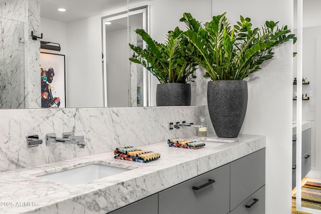 bathroom with vanity and backsplash