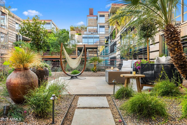 view of home's community with an outdoor living space and a patio