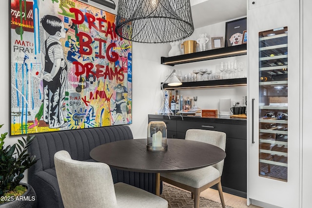 dining area featuring bar area