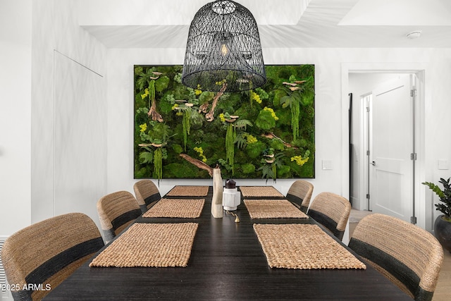 dining area featuring a notable chandelier