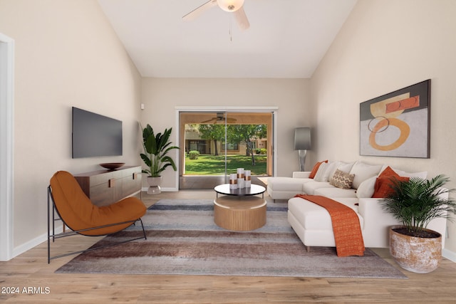 living room with ceiling fan, high vaulted ceiling, and light wood-type flooring