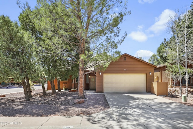 rustic home with an attached garage and driveway