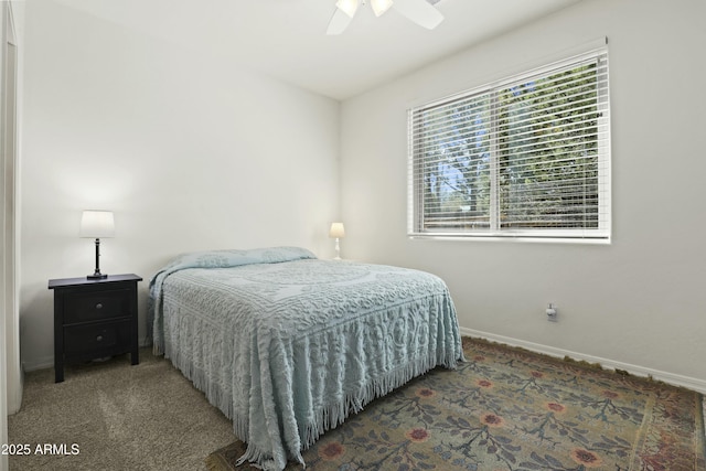 bedroom featuring baseboards, a ceiling fan, and carpet floors
