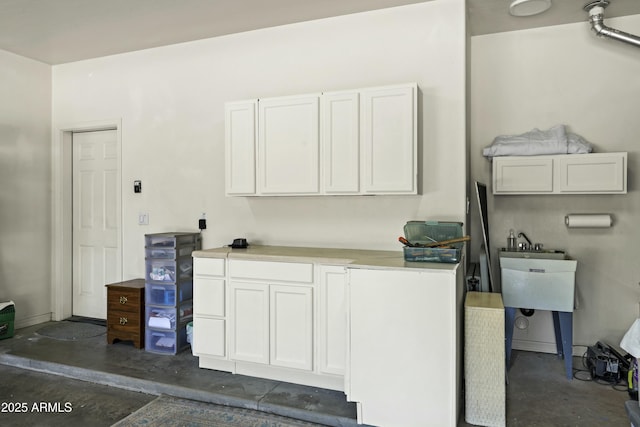 clothes washing area with a sink