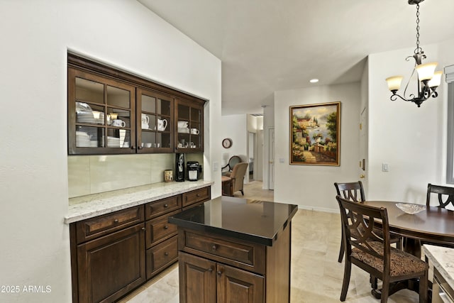 bar with pendant lighting, baseboards, an inviting chandelier, and recessed lighting