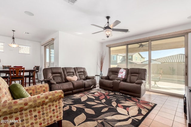 19889 W Montecito Ave, Litchfield Park, AZ 85340 - living area featuring light tile patterned flooring and ceiling fan