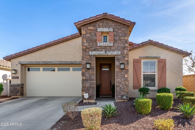 mediterranean / spanish-style house featuring stucco siding, concrete driveway, an attached garage, stone siding, and a tiled roof