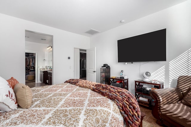 19889 W Montecito Ave, Litchfield Park, AZ 85340 - bedroom with black fridge and a spacious closet