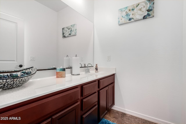19889 W Montecito Ave, Litchfield Park, AZ 85340 - bathroom with double vanity and baseboards