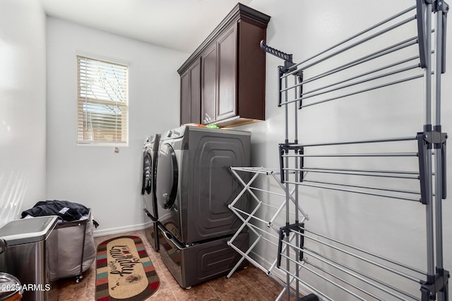 19889 W Montecito Ave, Litchfield Park, AZ 85340 - washroom with washing machine and clothes dryer, cabinet space, and baseboards