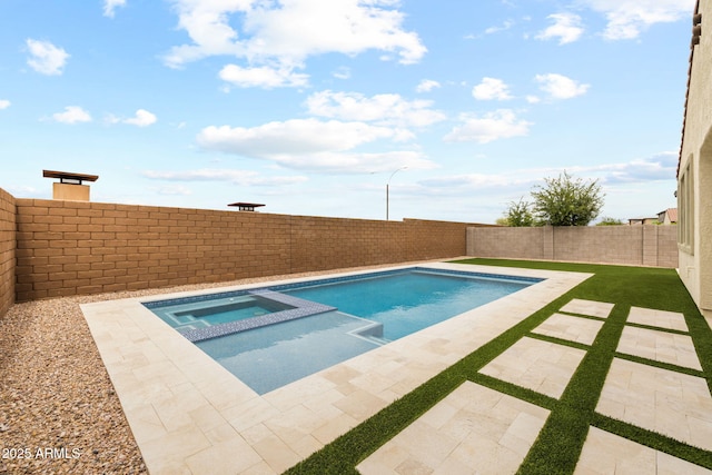 view of swimming pool featuring a fenced backyard, a patio area, and a pool with connected hot tub